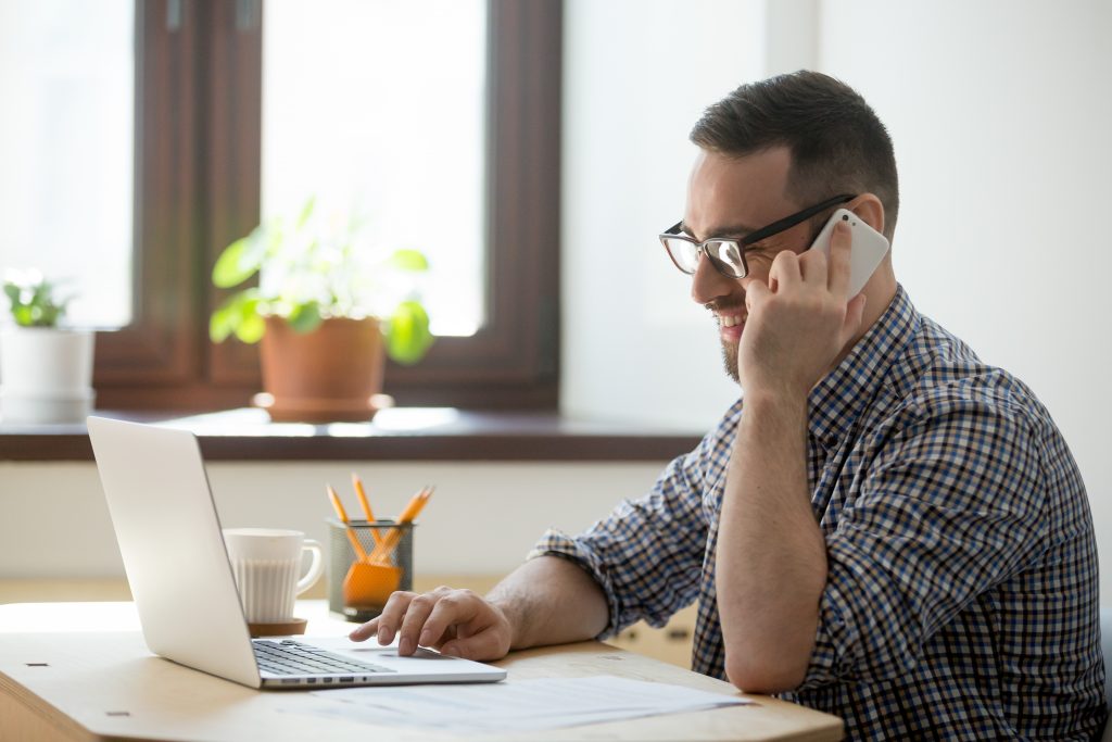 Salesperson helping a client over the phone.